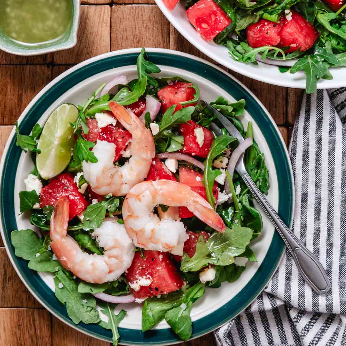 Steamed shrimp over watermelon arugula salad.