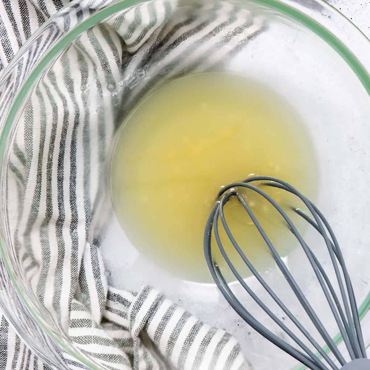 Whisking lime vinaigrette for salad.