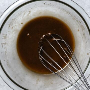 whisking balsamic vinaigrette