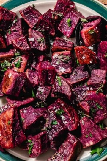 roasted purple sweet potato cubes with olive oil and salt