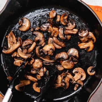 cooking mushrooms in a cast iron skillet