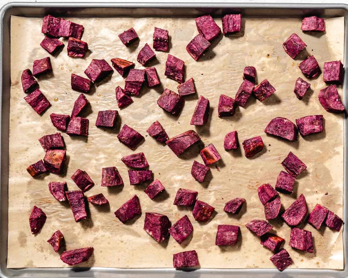 roasted purple sweet potatoes on sheet pan