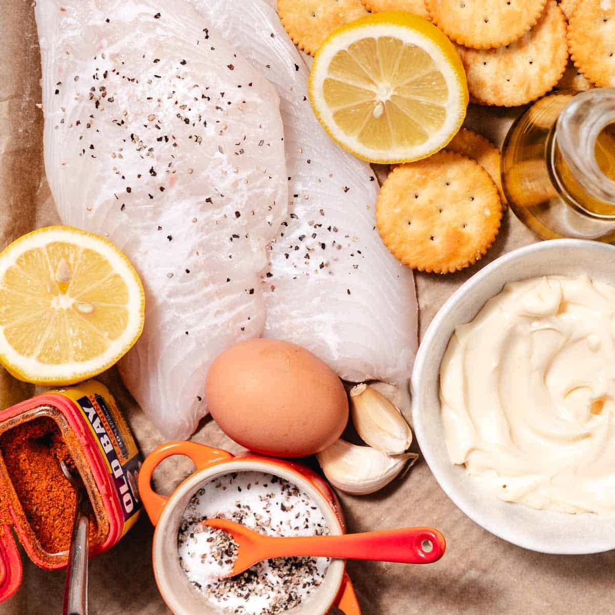 Ingredients for fried hogfish with garlic aioli — hogfish fillets, Ritz crackers, eggs, Old Bay, mayonnaise, garlic, lemon, and oil.