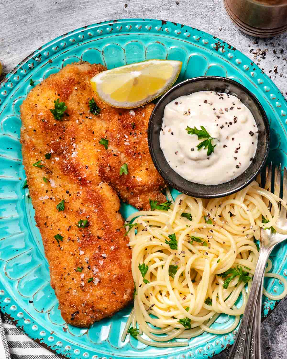 fried hogfish with buttery spaghetti with parsley and salt and garlic aioli
