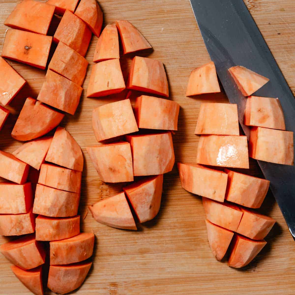 slicing raw sweet potatoes