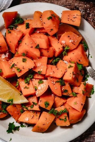 Overhead image of cut sweet potatoes on a cutting board.Overhead image of cut sweet potatoes on a cutting board.