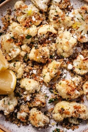 Roasted cauliflower with golden breadcrumb topping and grated Locatelli.
