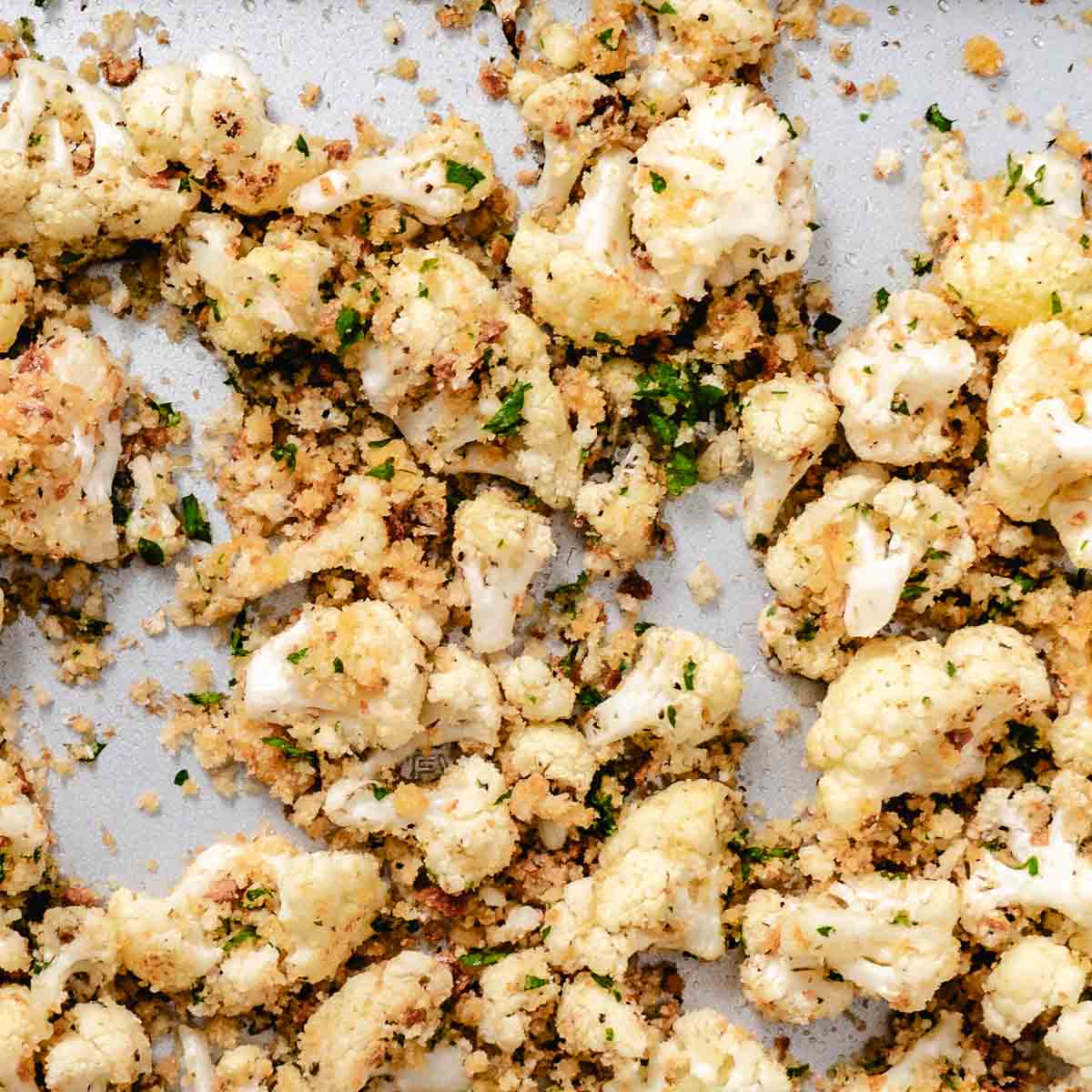 Roasted cauliflower topped with buttered breadcrumbs before returning to the oven.