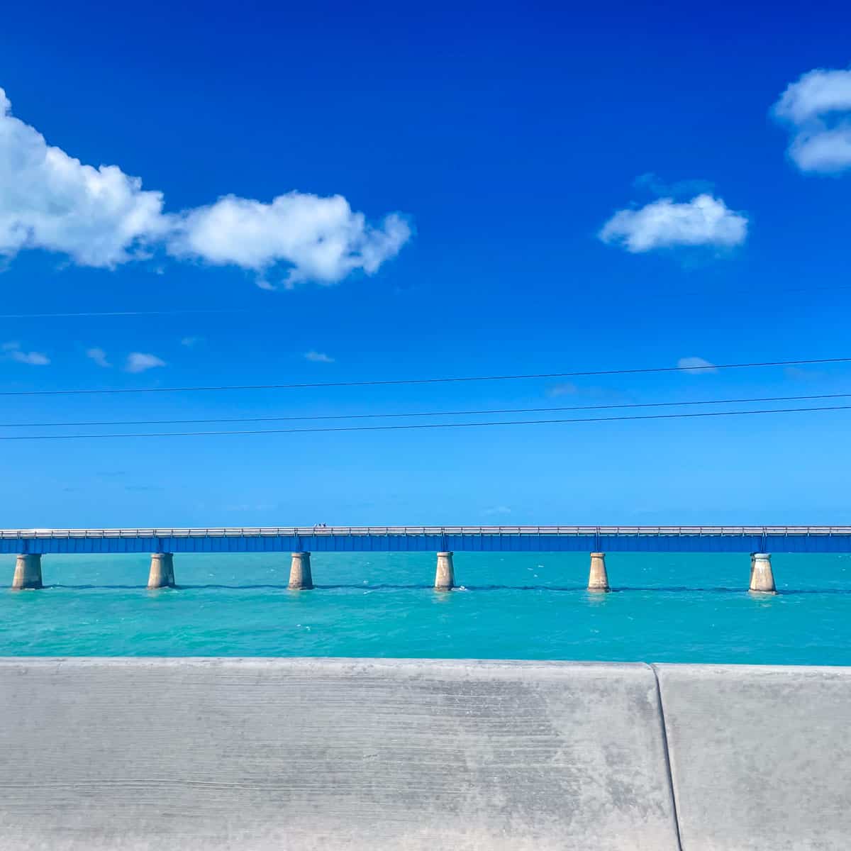 Overseas Highway bridge over turquoise water in the Florida Keys on the drive from Miami to Key West.