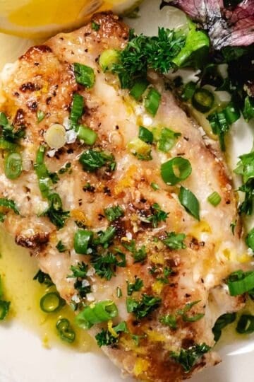 Pan seared tilefish with lemon butter, chopped green onions, and a simple mixed greens salad.