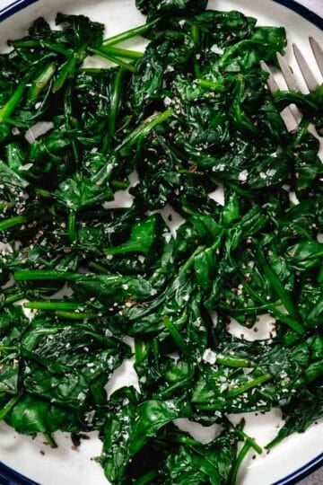 plate of steamed spinach.