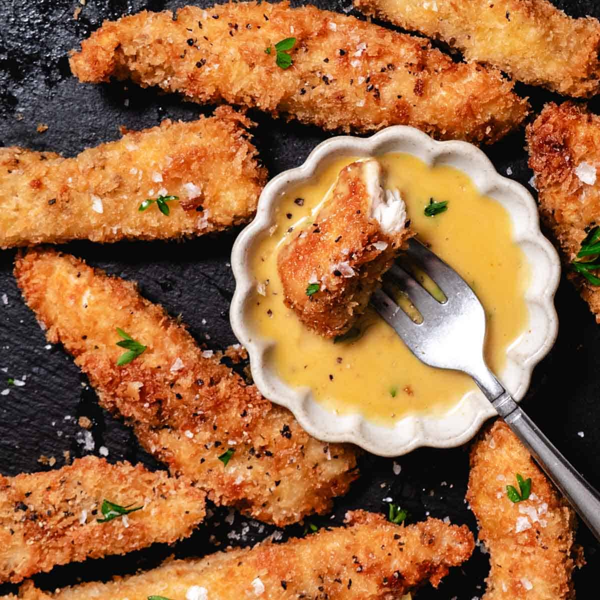 Crispy panko chicken strips served with honey mustard dipping sauce