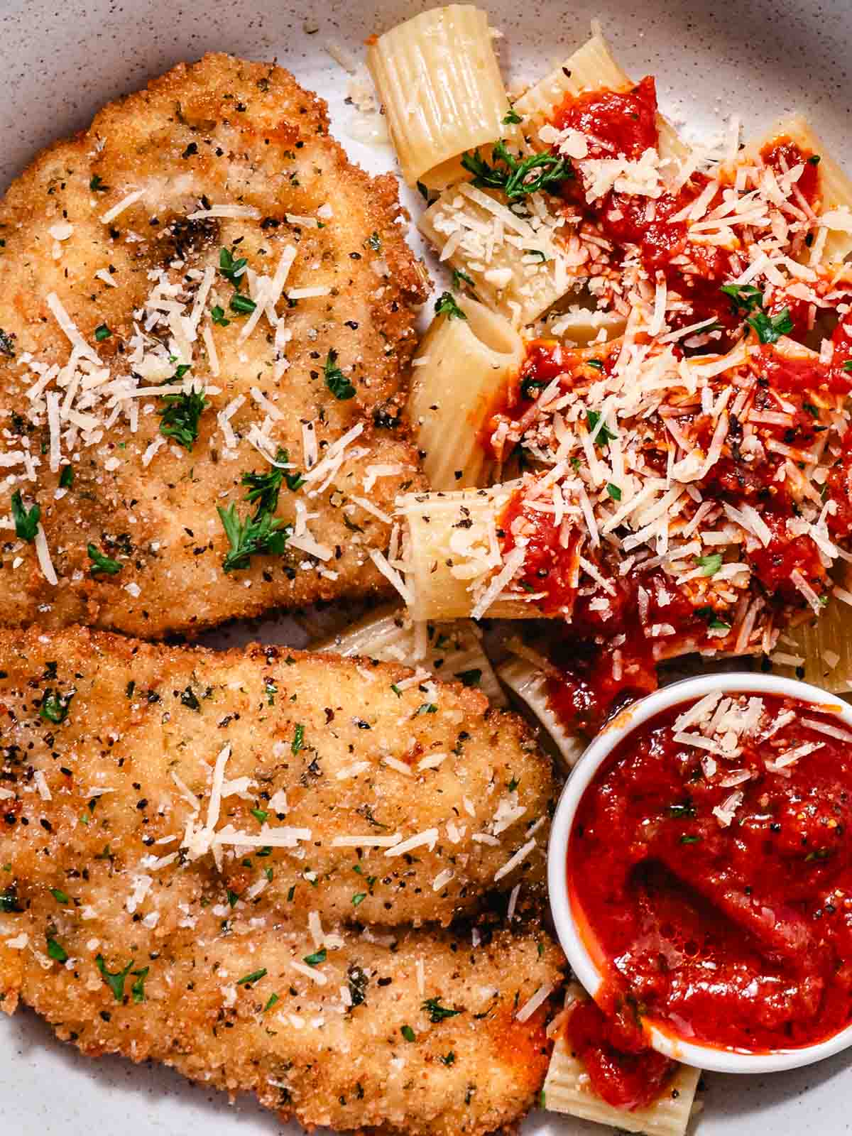 breaded and fried chicken cutlets with rigatoni and marinara