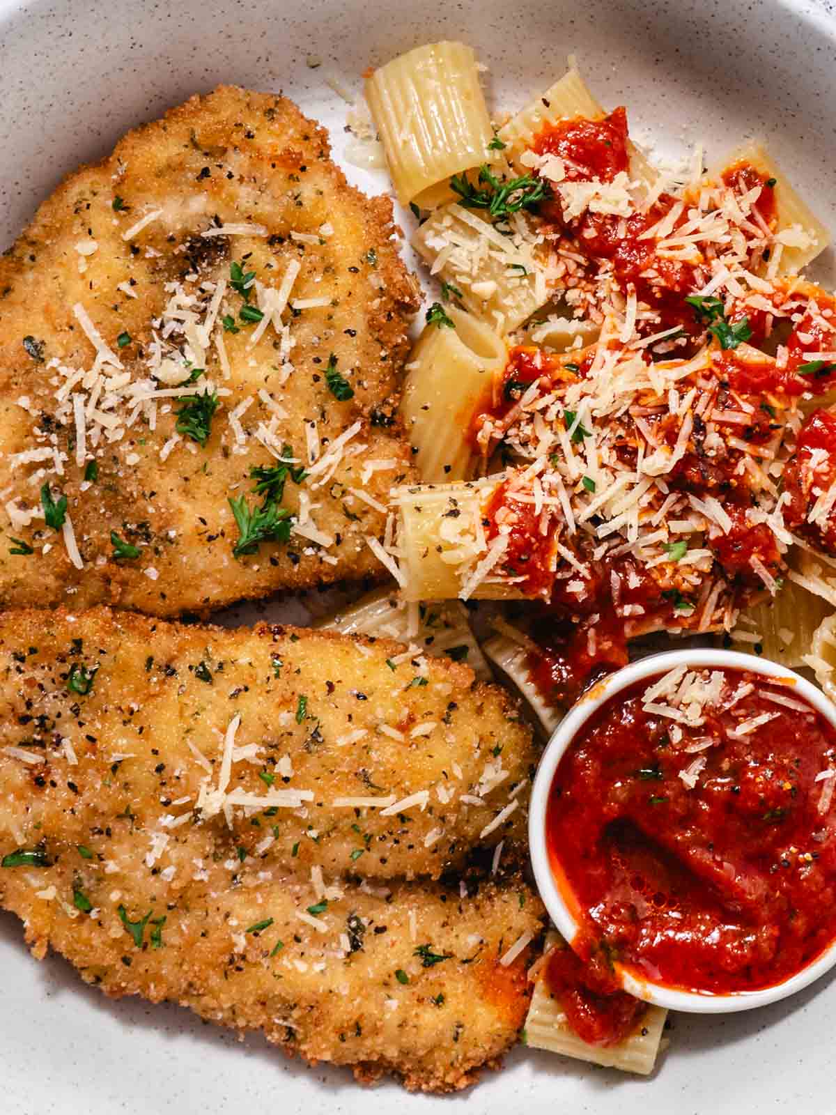 breaded and fried chicken cutlets with rigatoni and marinara
