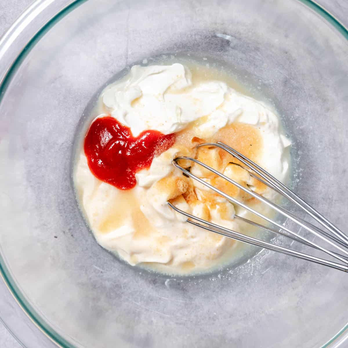 creamy taco sauce ingredients in bowl before mixing with sour cream, mayo, and sriracha