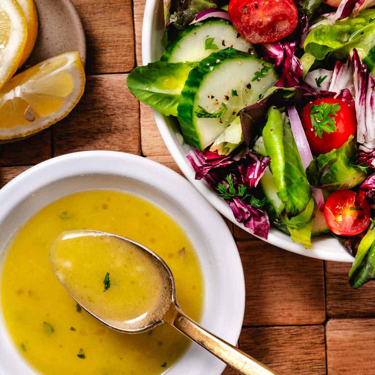lemon dijon vinaigrette in bowl served with fresh garden salad
