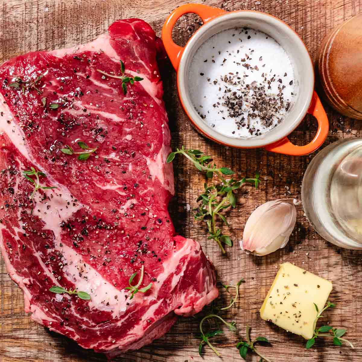 rib eye steak, salt, pepper, garlic, butter, fresh thyme, olive oil