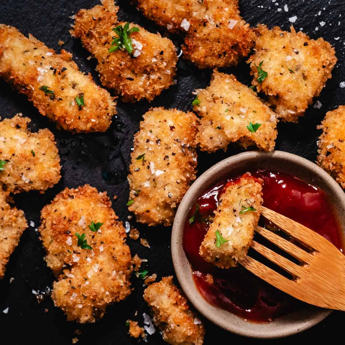Panko chicken nuggets served with ketchup dipping sauce