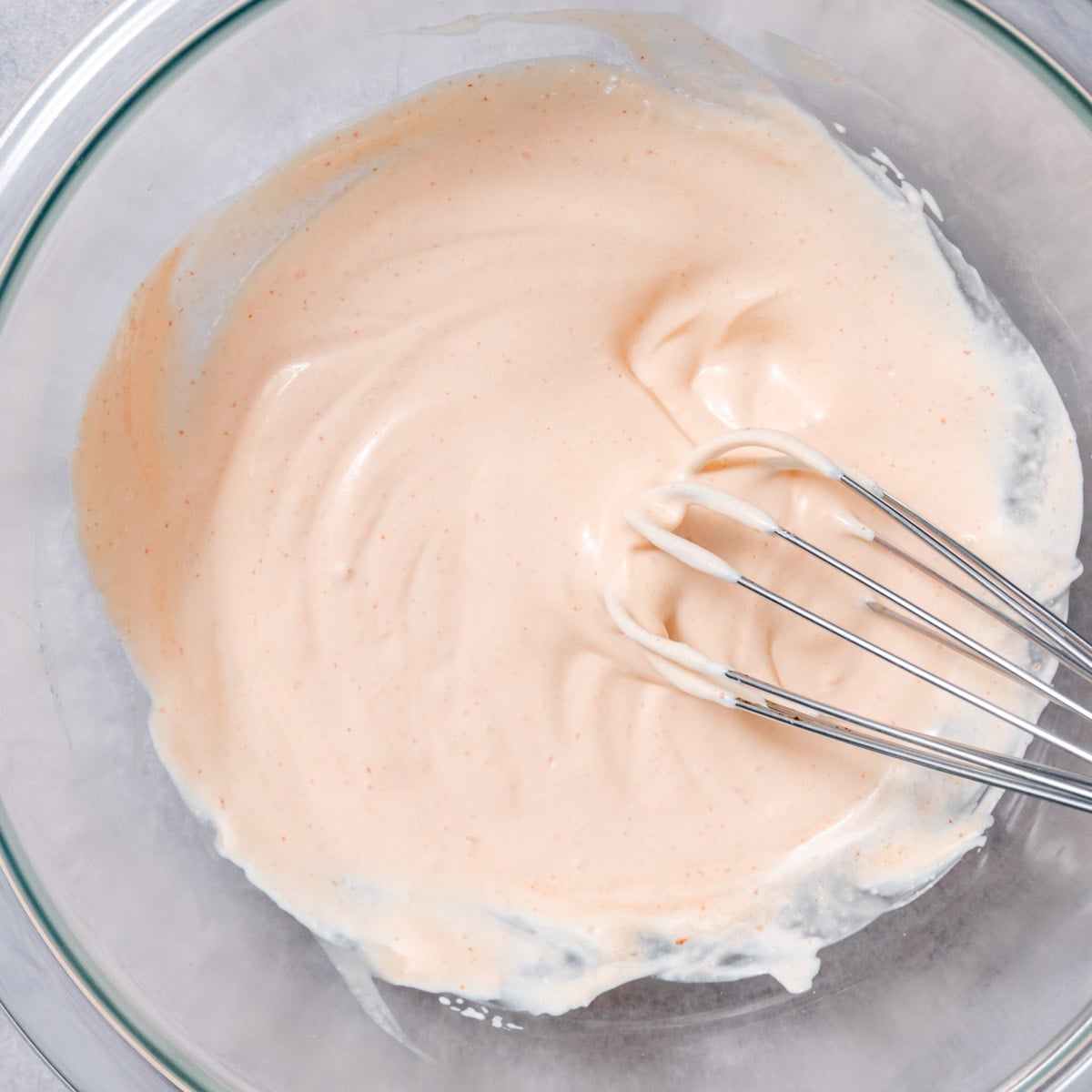creamy taco sauce ingredients in bowl before mixing with sour cream, mayo, and sriracha