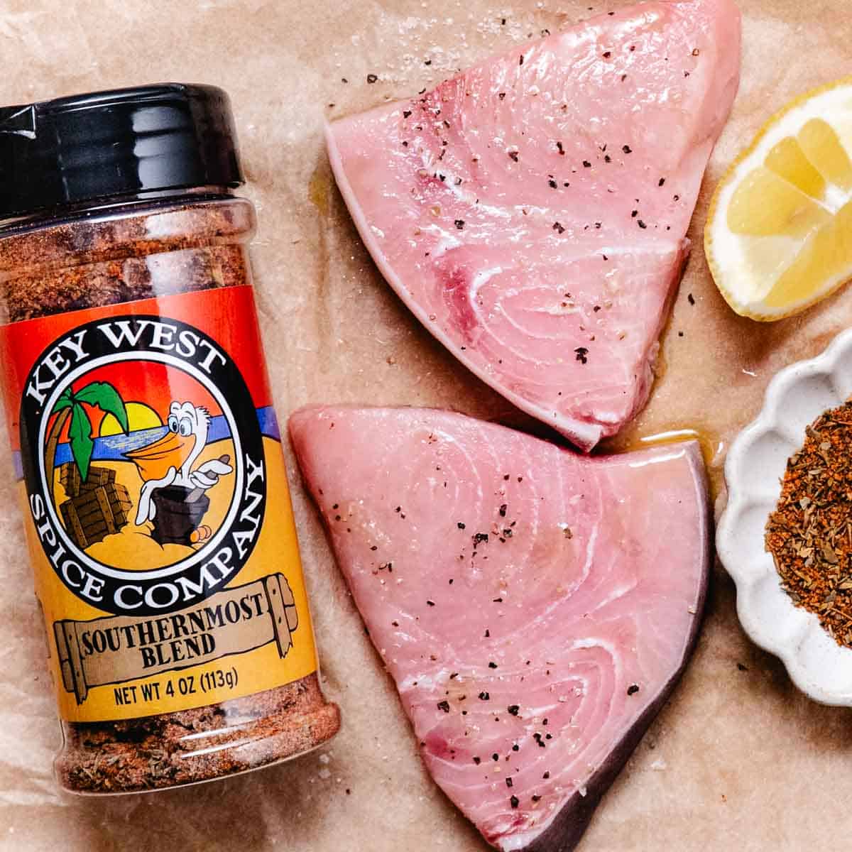 swordfish steaks with lemon wedges and key west seasonings