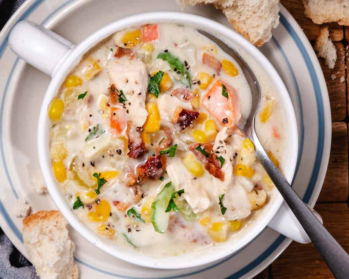 Corn and Chicken Soup with bacon and potatoes in a crock.