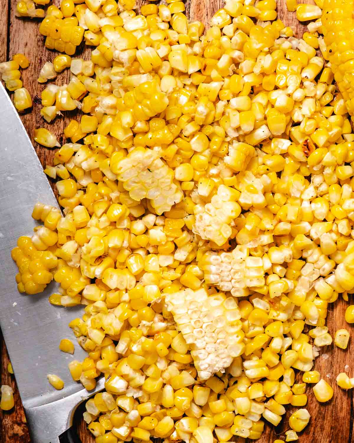 Slicing corn off corn on the cob.