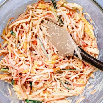 Mango kani salad with shredded imitation crab, cucumber, carrot, mango, and masago mixed in a creamy dressing.