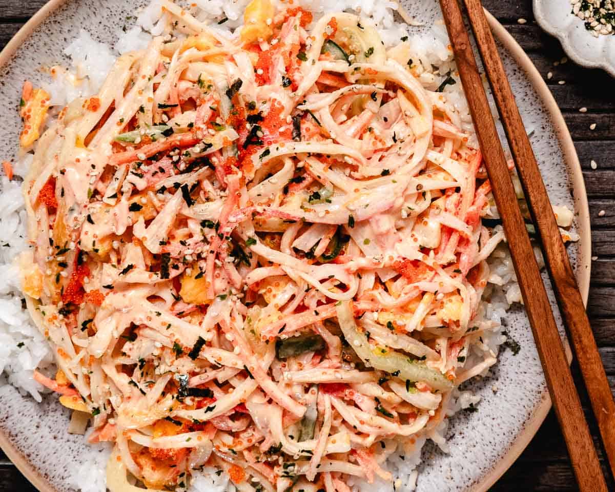 Bowl of mango kani salad with furikake seasoning and tobiko