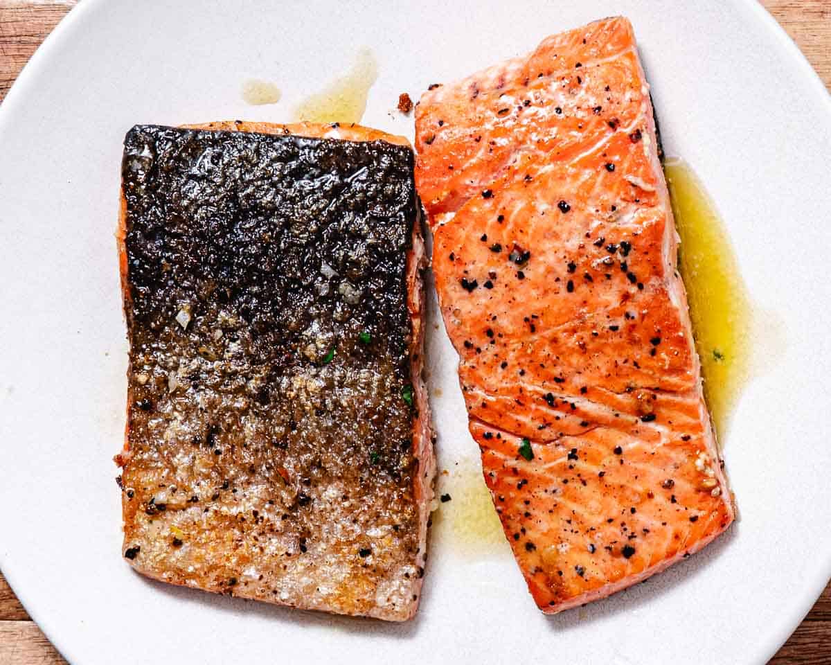 Pan seared coho salmon fillets showing crispy skin and tender cooked flesh.
