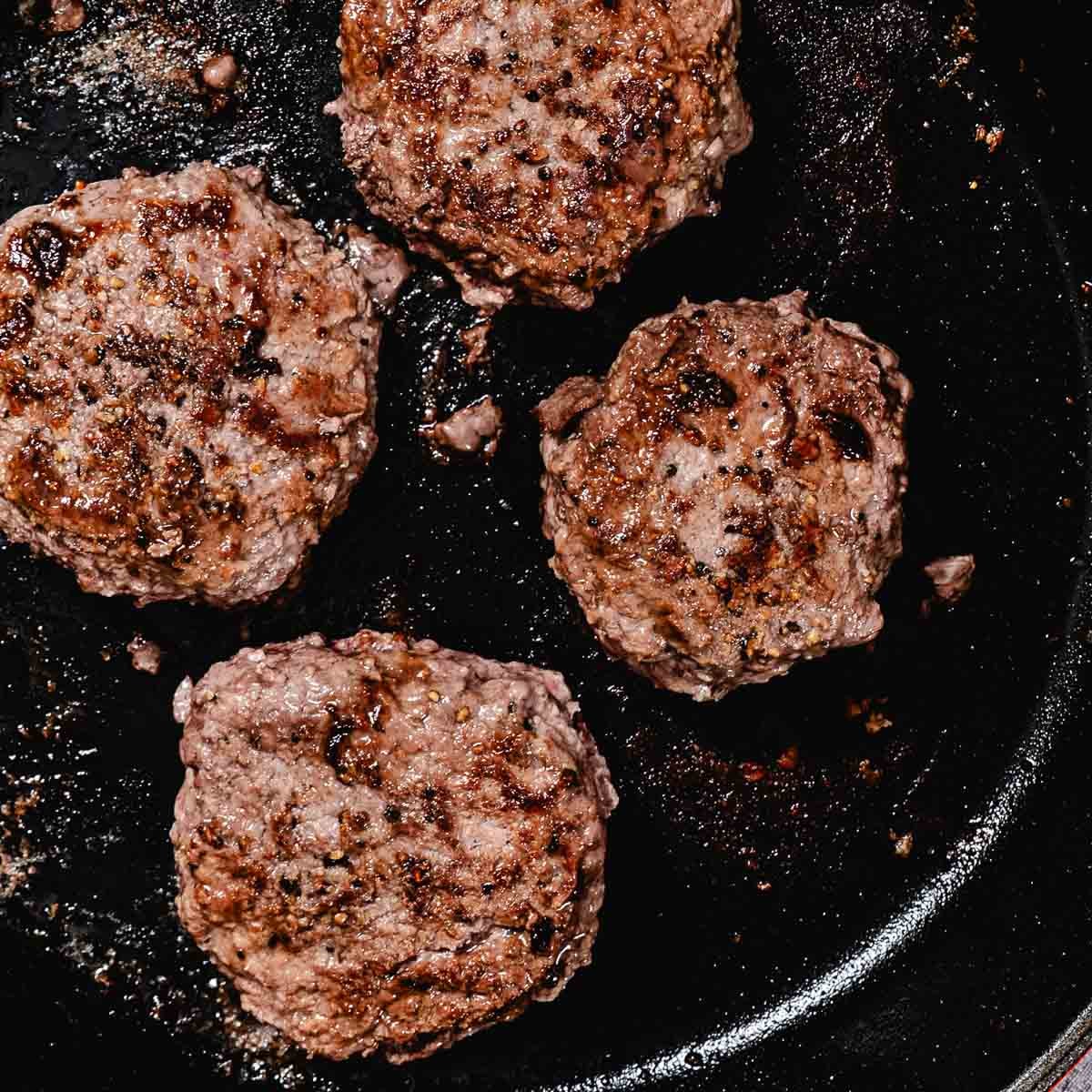 cooking hamburger in a skillet