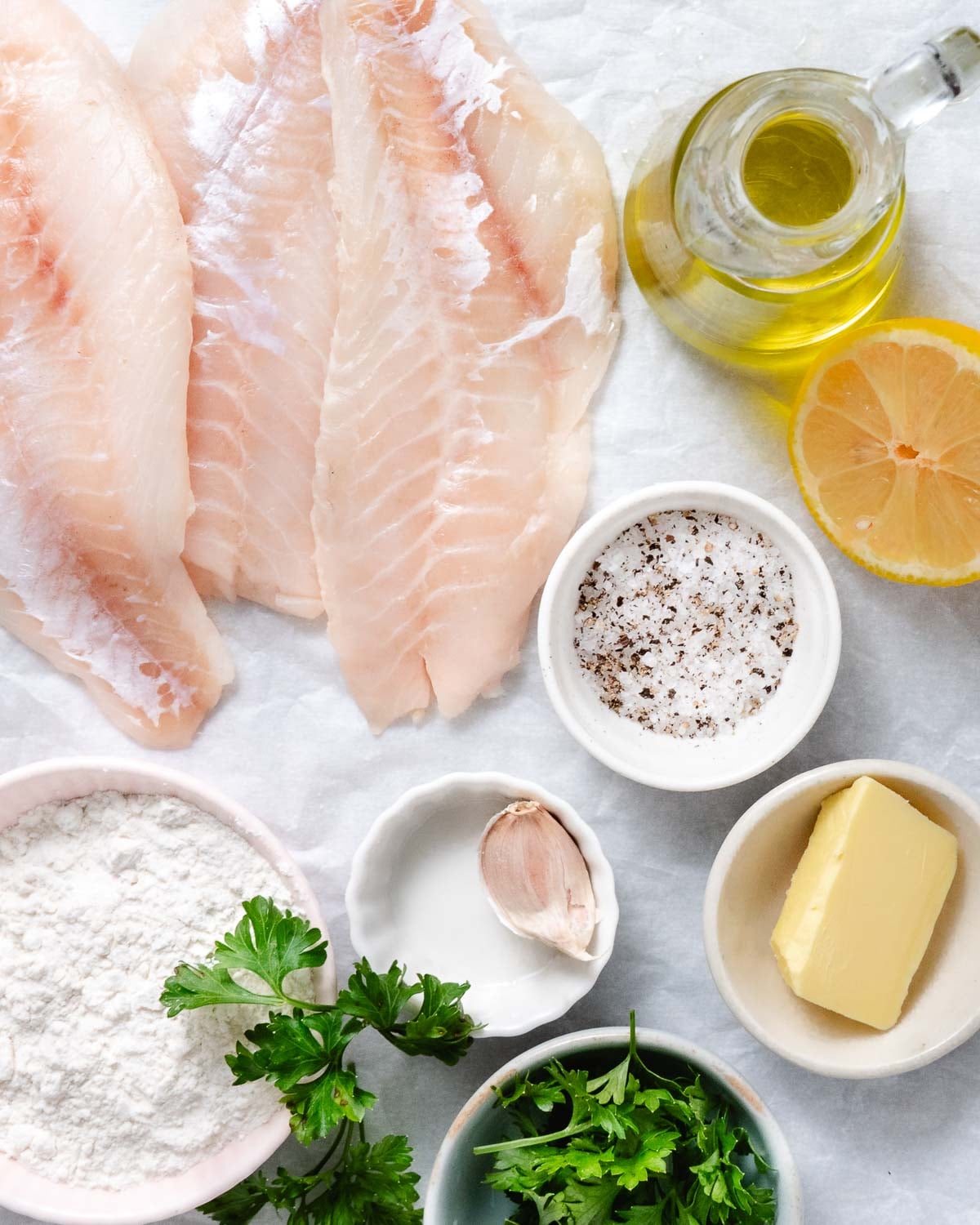 Blackbelly rosefish fillets with flour, lemon, garlic, butter, olive oil, parsley, salt, and pepper