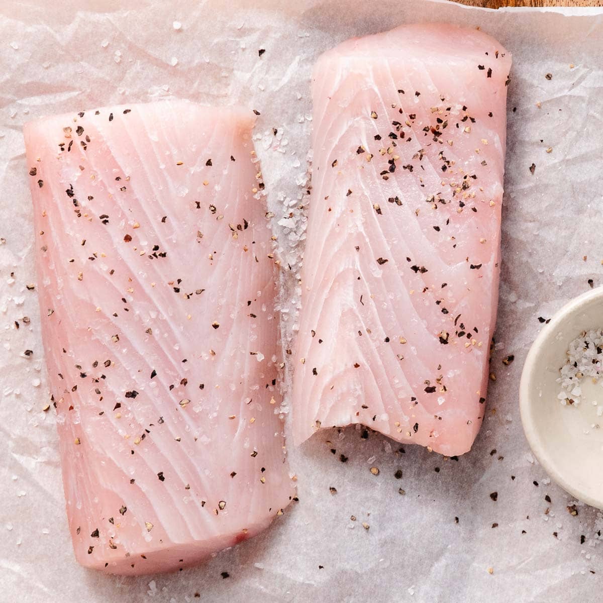 Mahi mahi fillets seasoned with salt and pepper