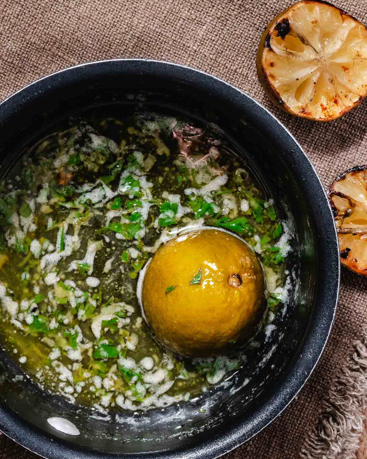 Warm garlic lime butter sauce in a small bowl.