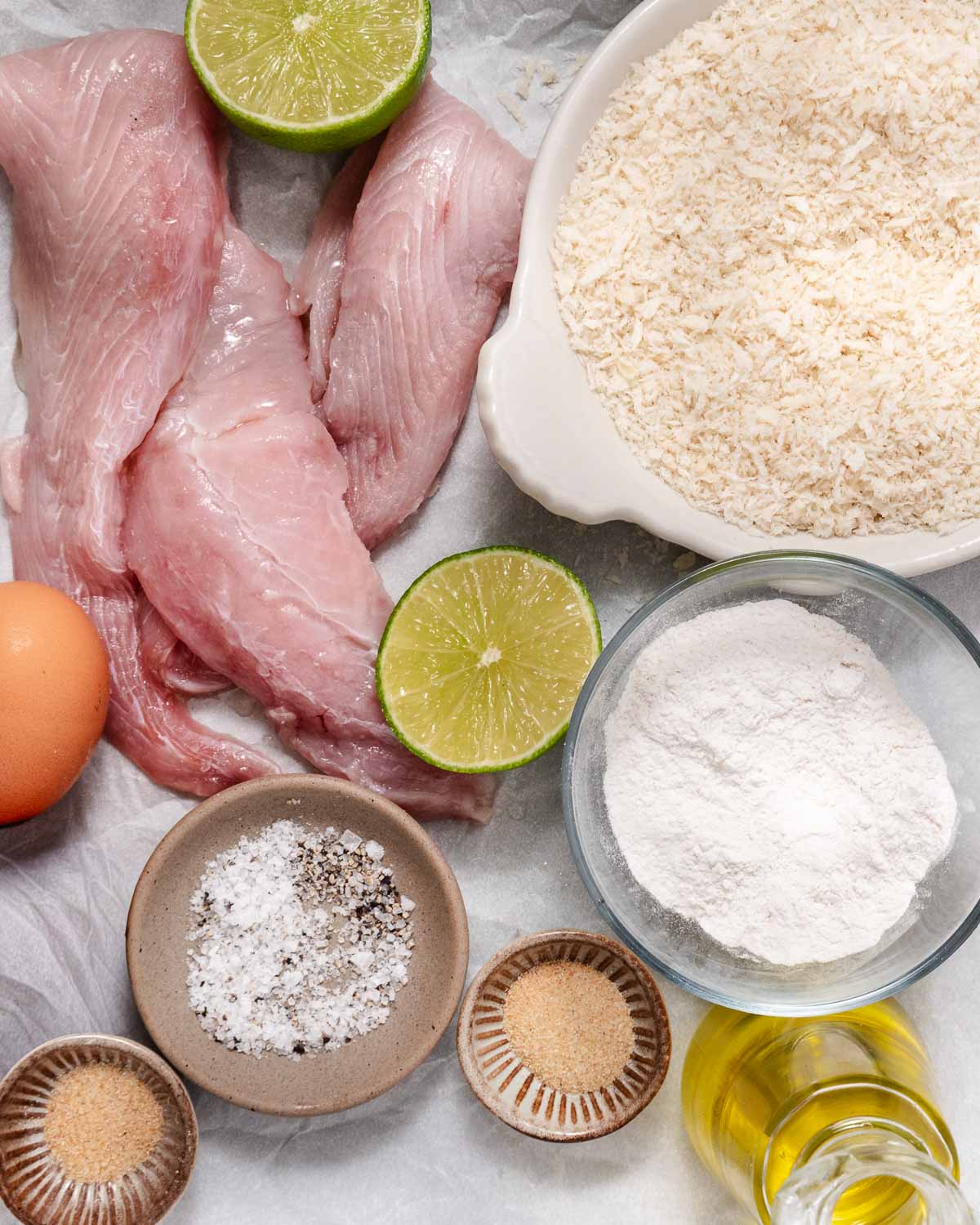 Ingredients for crispy mahi mahi bites: mahi mahi, panko, flour, egg, lime, oil, salt, pepper, garlic powder, and onion powder.