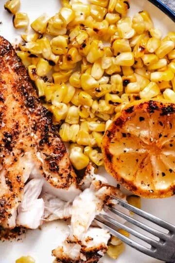 grilled fish with corn and a caramelized lemon