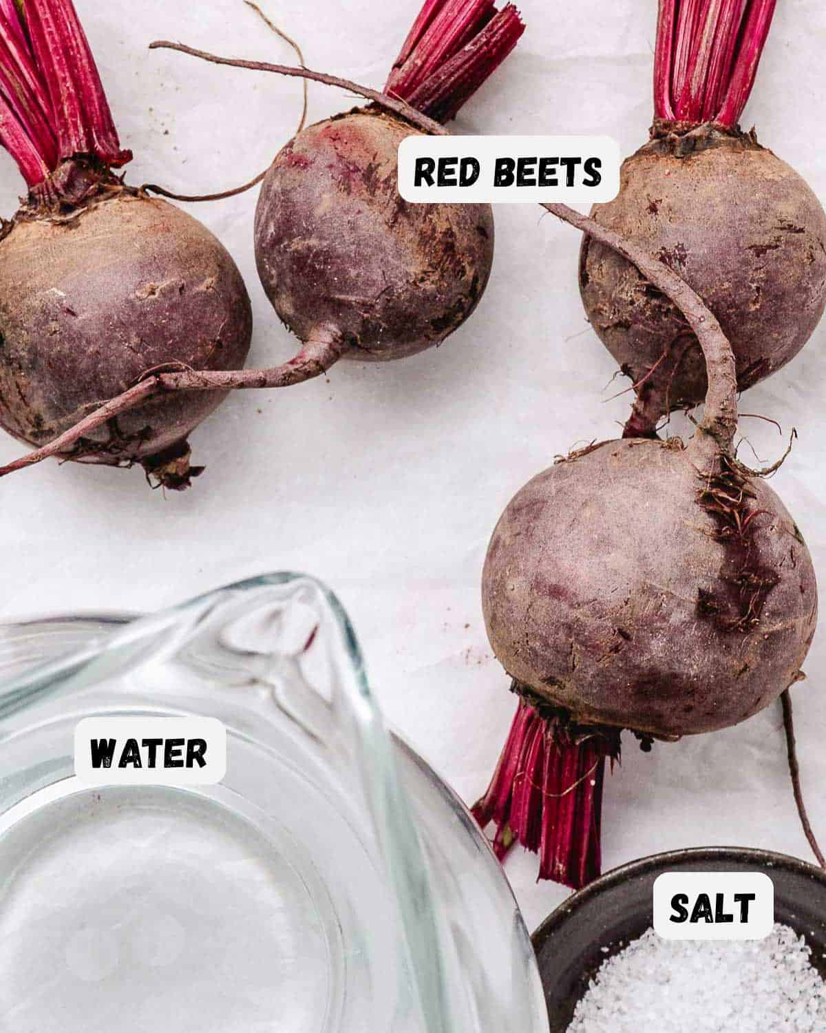 Fresh red beets, butter, and kosher salt for making steamed red beets.
